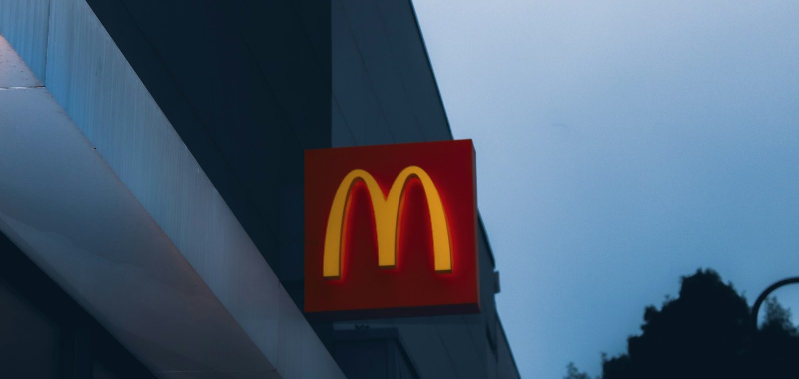 a close up of a mcdonald's sign on a building